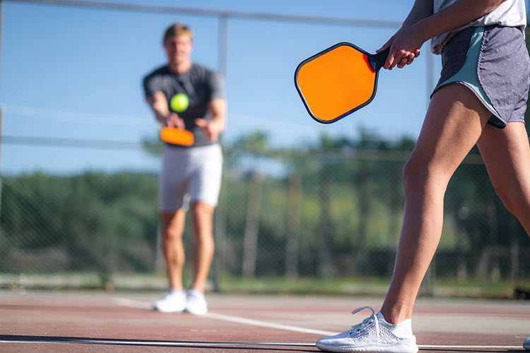 Couple playing pickleball
