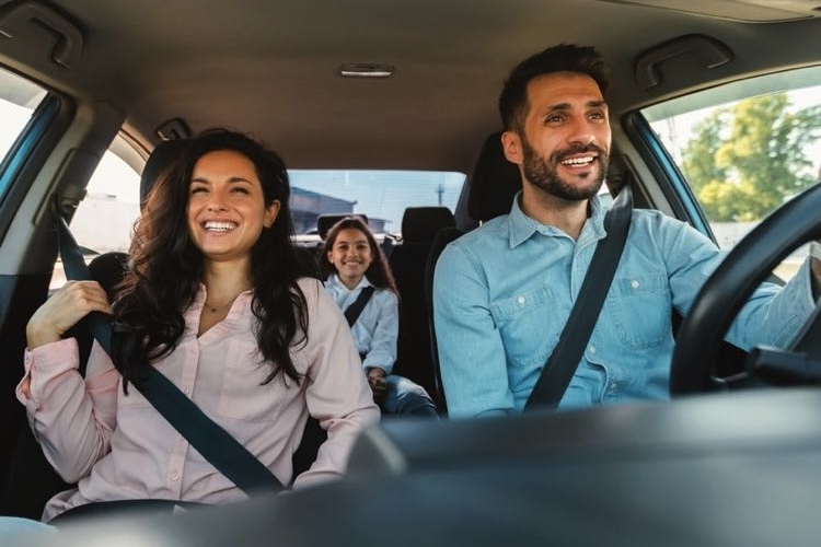 Couple in car smiling