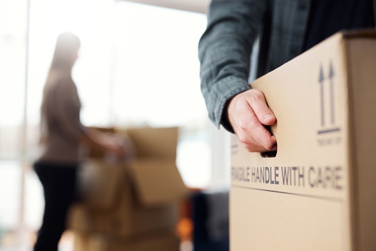 Man Moving Home Holding Box