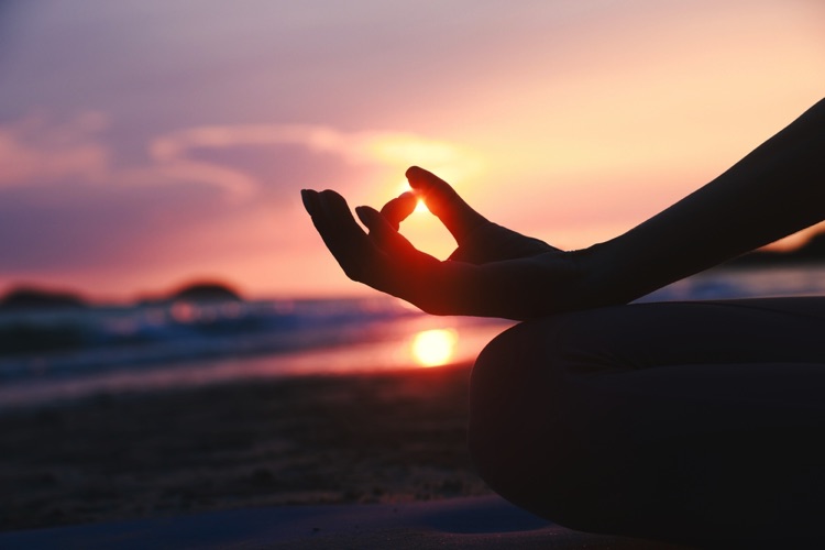 Meditating at sunset