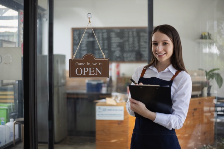 Woman shop owner open for business