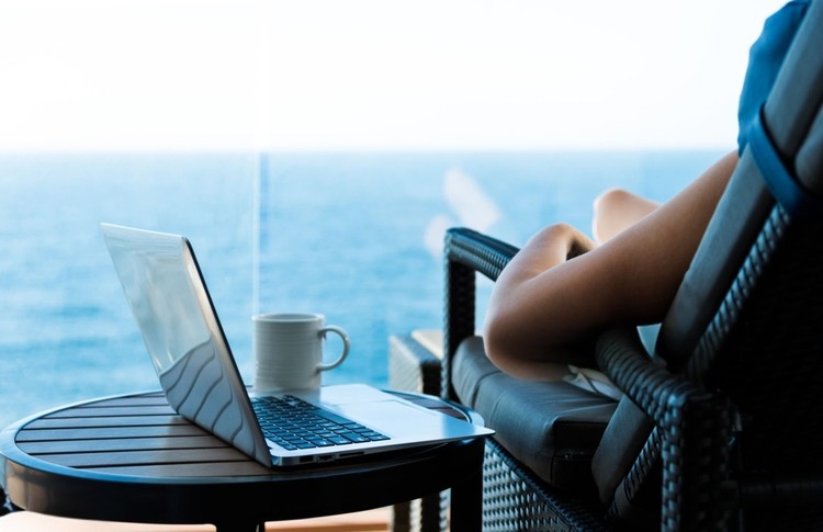Passenger Relaxing with Laptop on Cruise Ship