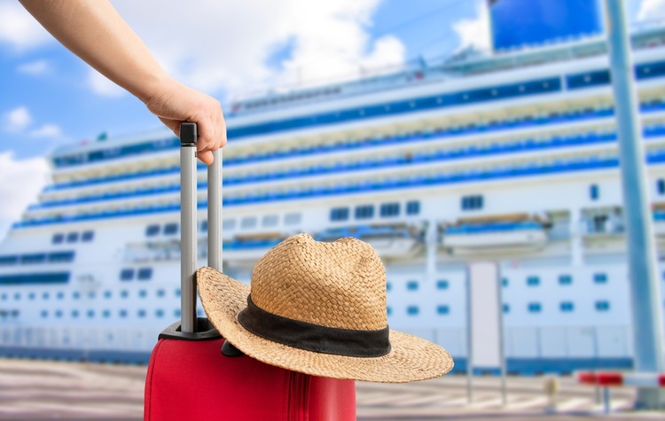 Passenger with Red Suitcase Next to Cruise Ship