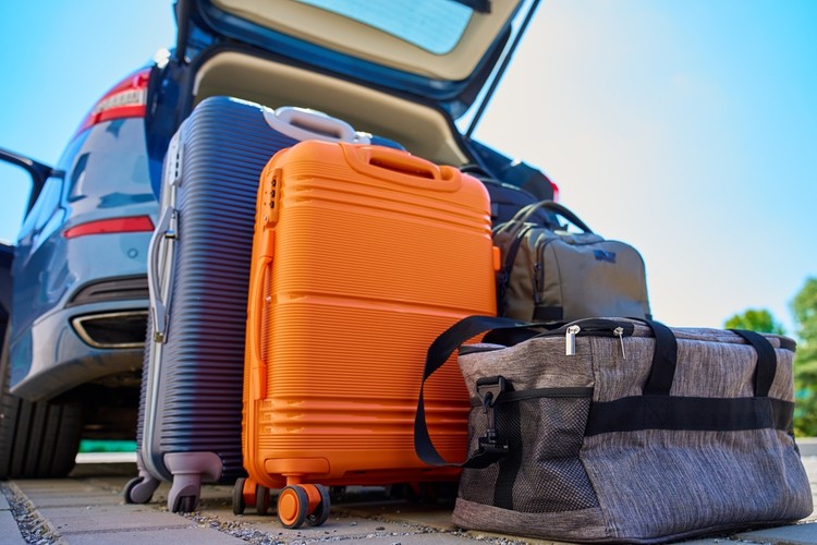 Luggage Against Open Car Boot