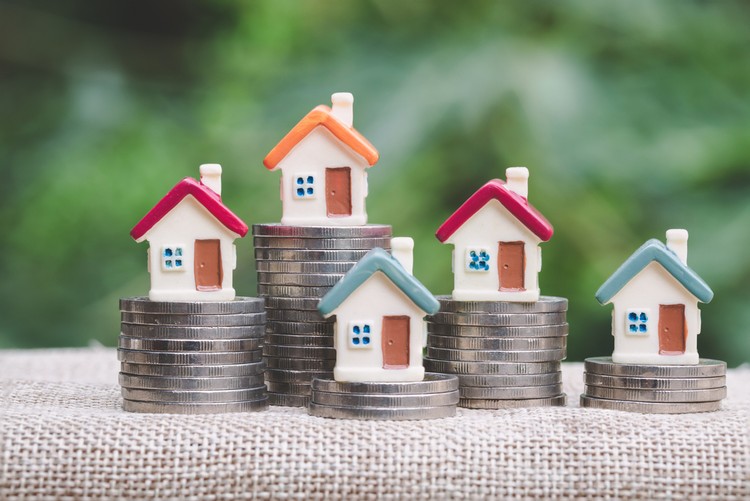Model Houses on Coin Stacks