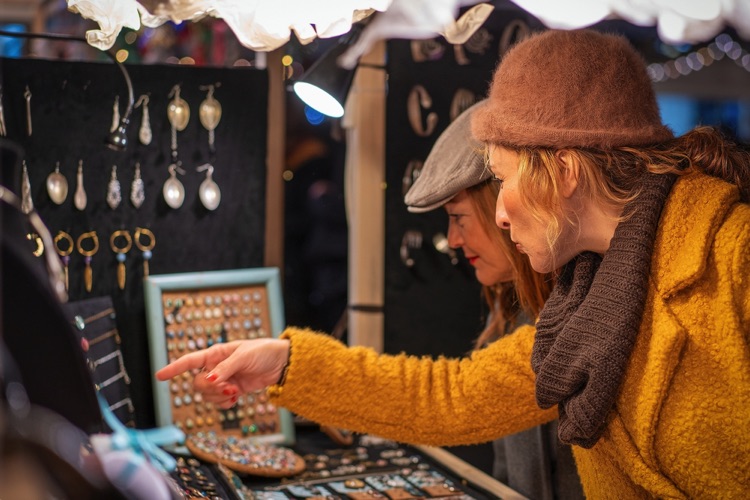 Women buying homemade jewellery